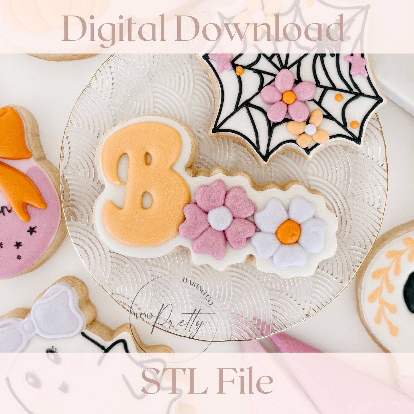 Decorated cookie that reads "BOO" with floral details.