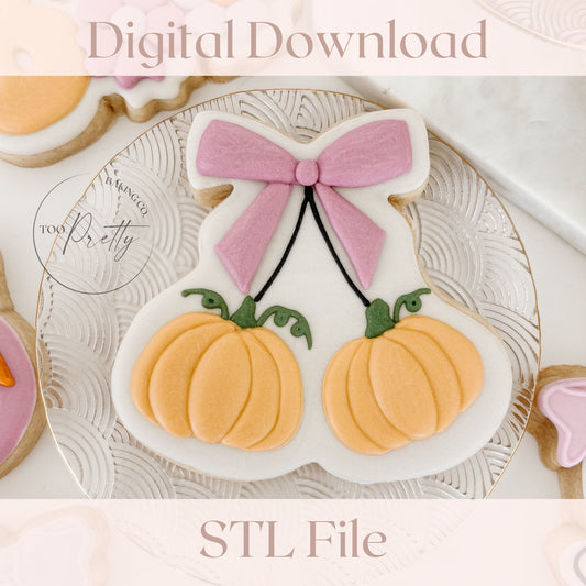Decorative cookie with pink bow and pumpkins on a white plate, digital download STL file.