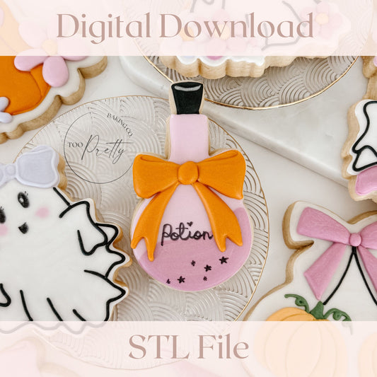 decorative cookie shaped like a potion bottle with a bow around it.