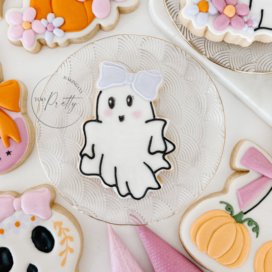 decorated cookie with girlie ghost with a bow on her head